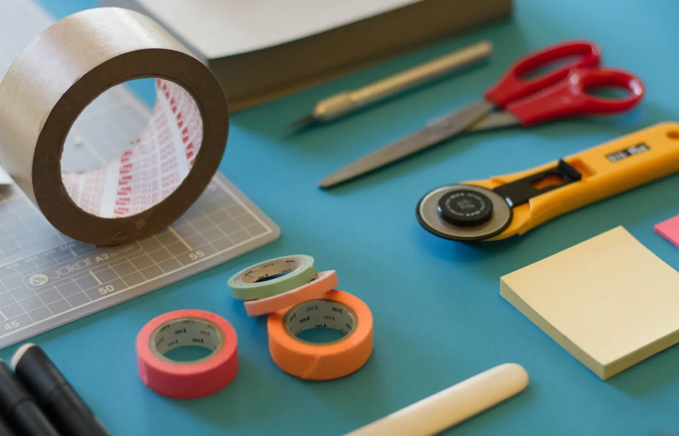 Maker arranging handmade pieces on a worktable for product photos